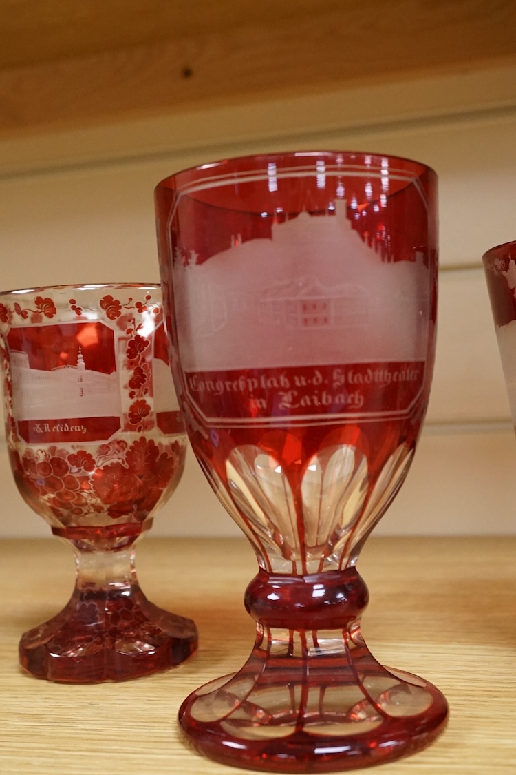 Three Bohemian topographical engraved ruby flashed spa glasses, late 19th century, largest 16cm high